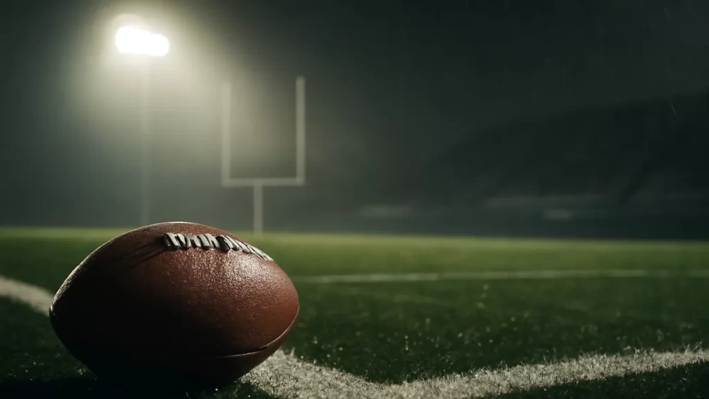 Maye’s late interception seals 13-10 Seahawks win in opener Wet football on end-zone turf under misty floodlights and empty stands.